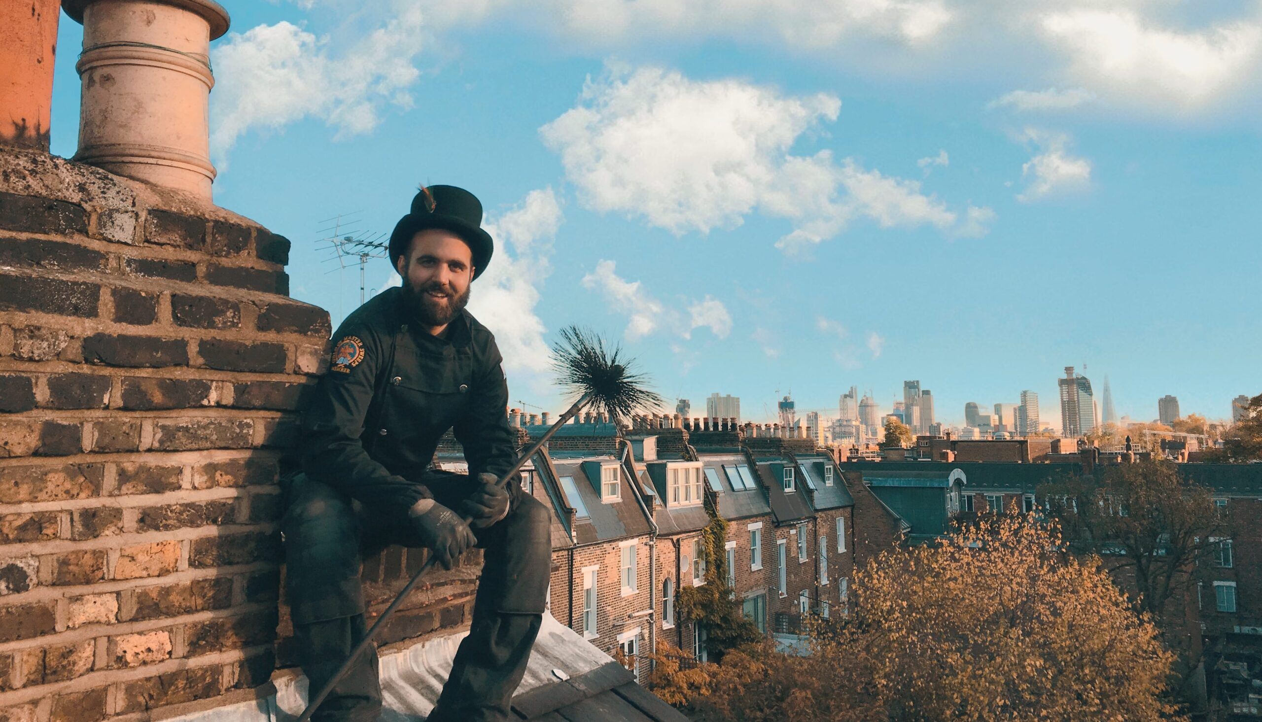 Chimney sweep on rooftop